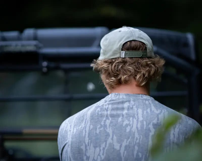 Dusters Outdoors hat worn in the field